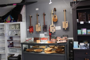 wall of cigar box guitars